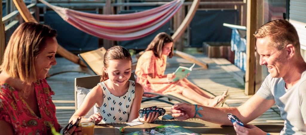 Family games on the terrace of a mobile home at Les Embruns